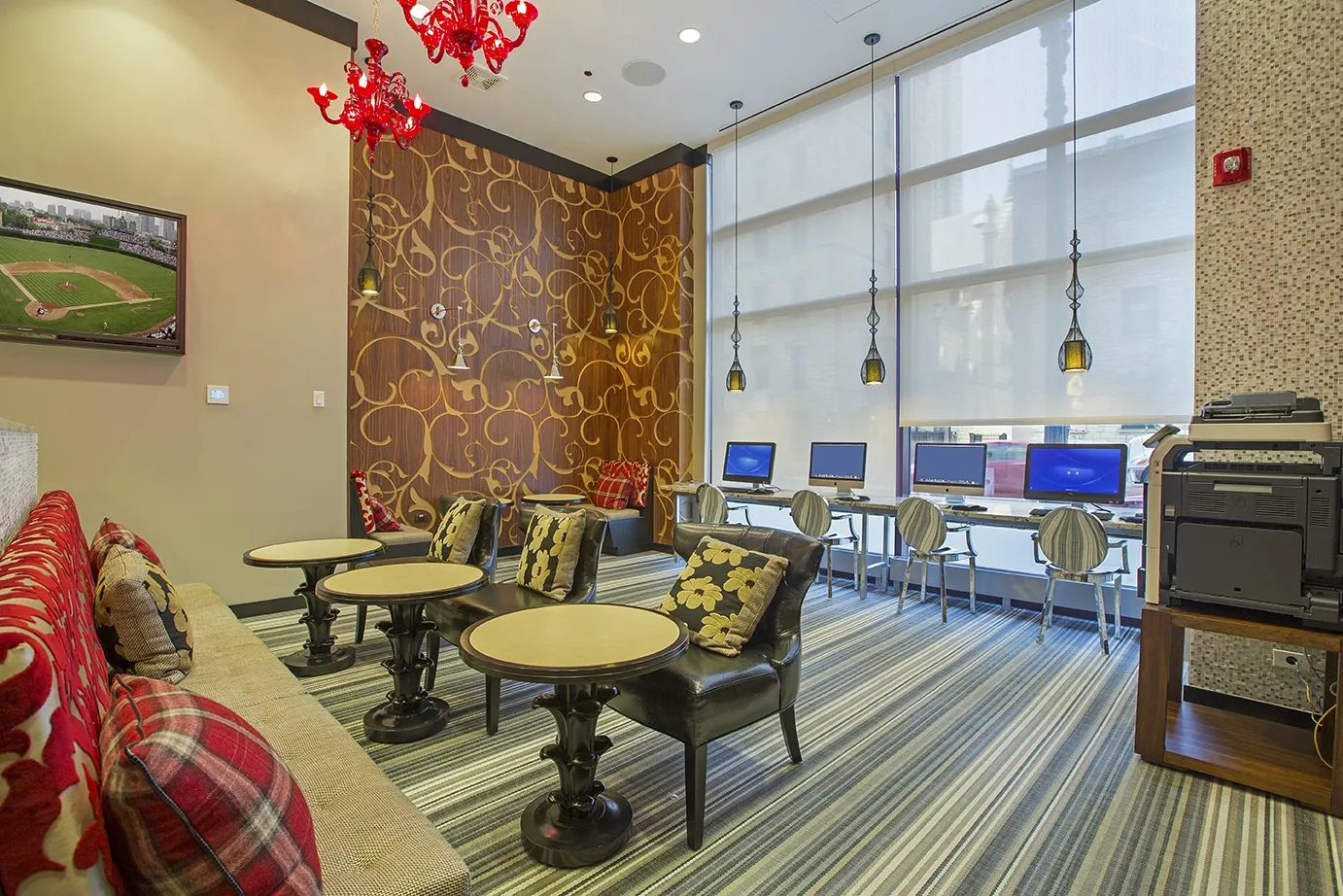 view looking up at The Bernardin Apartments with car traffic