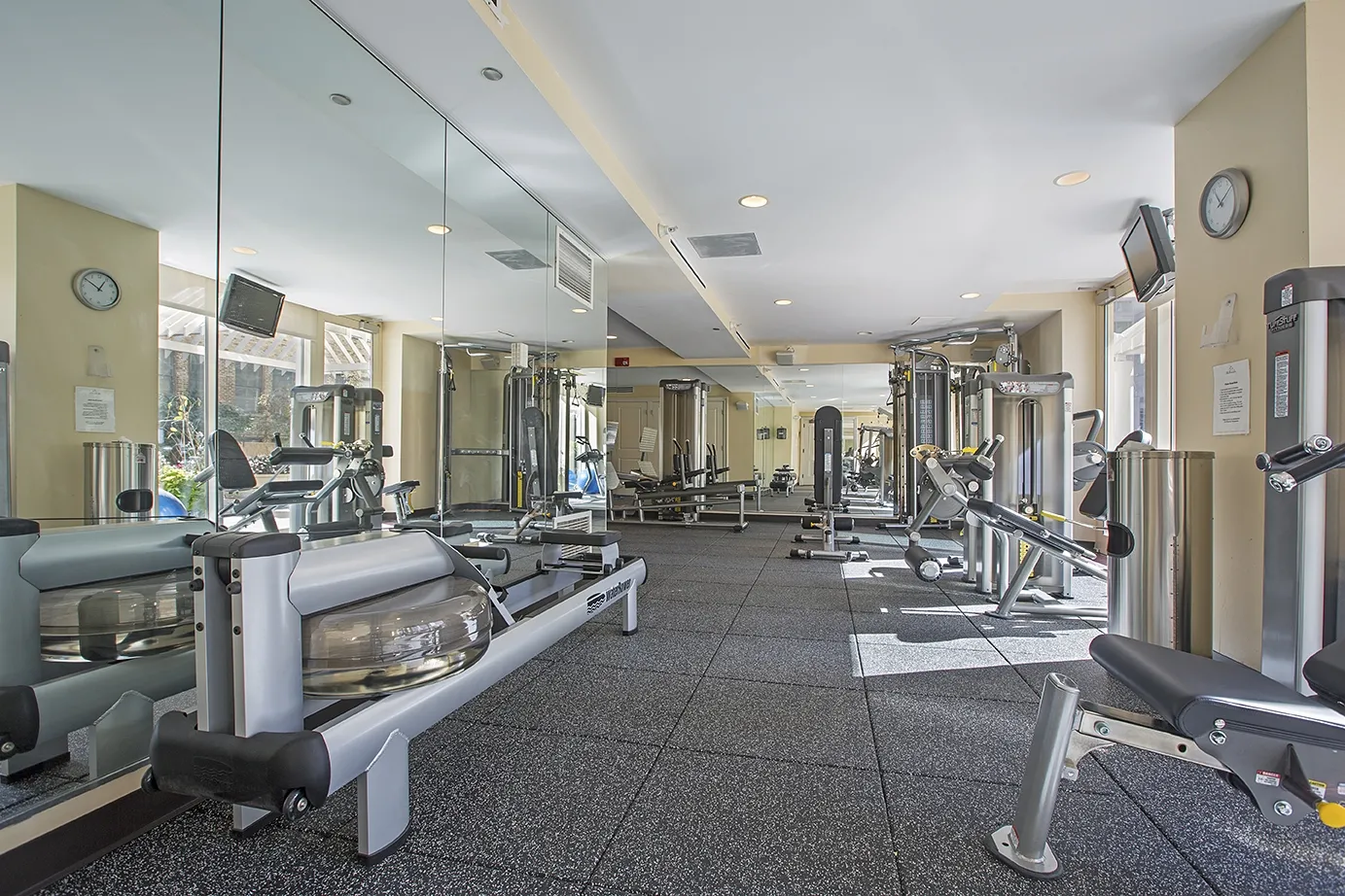 view looking up at The Bernardin Apartments with car traffic