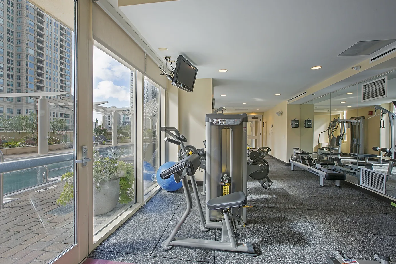 view looking up at The Bernardin Apartments with car traffic