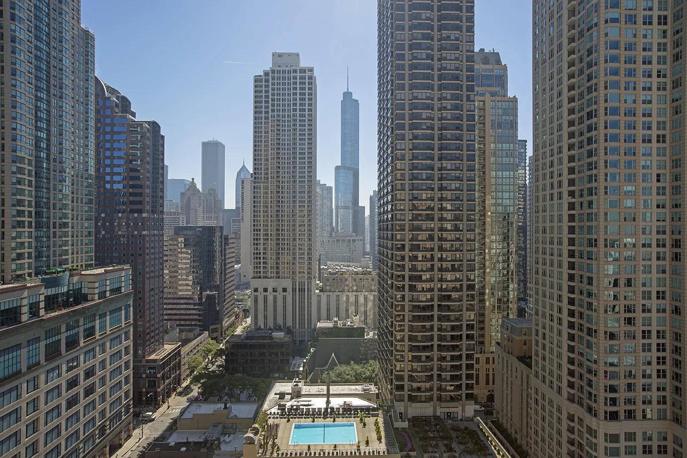 view looking up at The Bernardin Apartments with car traffic
