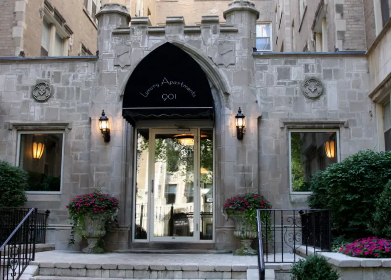 vintage building with courtyard and trees at The Renaissance Apartments
