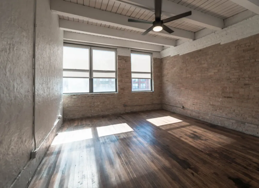 model kitchen with timber ceiling and brick wall- 1012 West Randolph Lofts