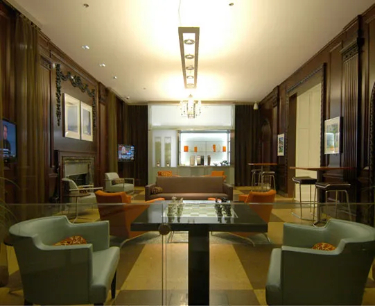 lobby entrance with limestone facade at The Belmont By Reside Apartments
