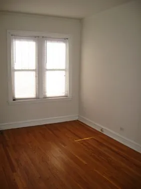 model kitchen with wood floors at 822-836 South Austin Apartments