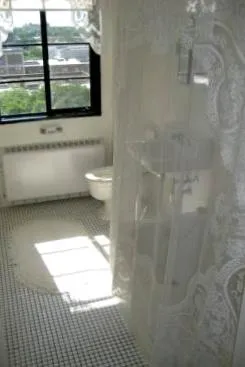 exterior view of trees and the two towers of 5630 North Sheridan Apartments