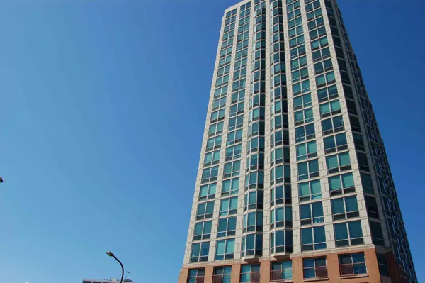 flowers surround the entrance of The Park Evanston Apartments in Evanston