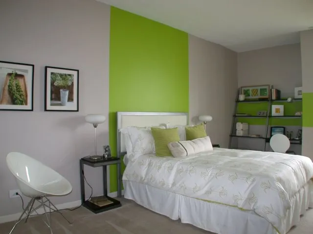 model bedroom with green wall at SCIO at the Medical District Apartments