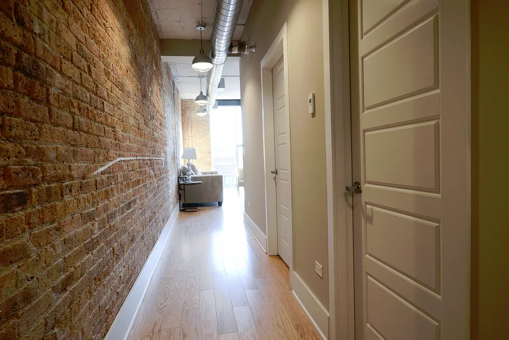 exposed brick in living room of 3141 North Sheffield Apartments in Lakeview