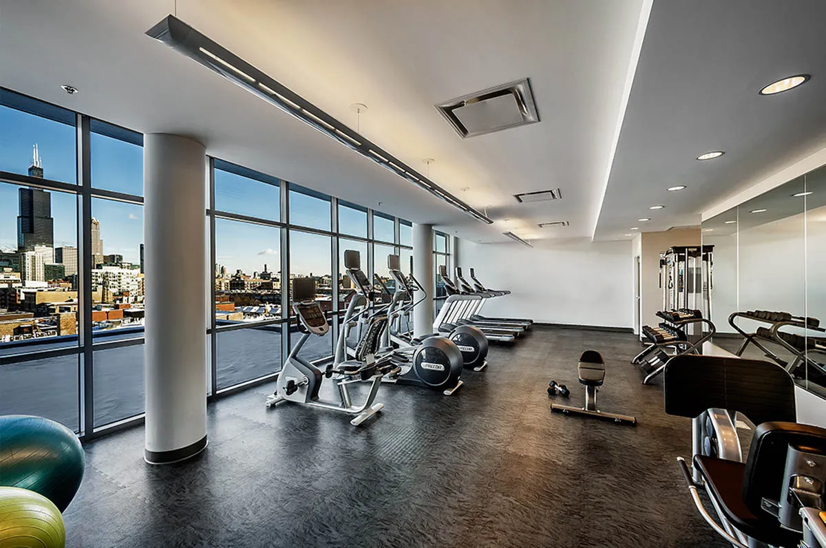 kitchen with view of living room at The Madison at Racine Apartments