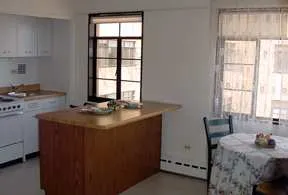 exterior view of trees and the two towers of 5630 North Sheridan Apartments