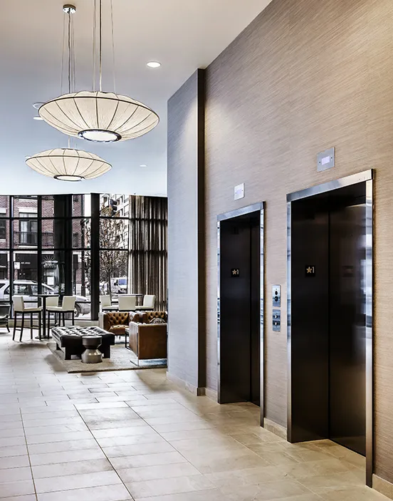 kitchen with view of living room at The Madison at Racine Apartments
