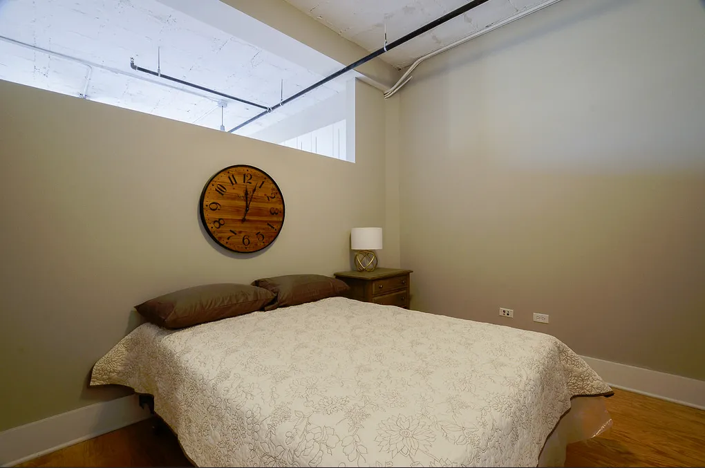 exposed brick in living room of 3141 North Sheffield Apartments in Lakeview