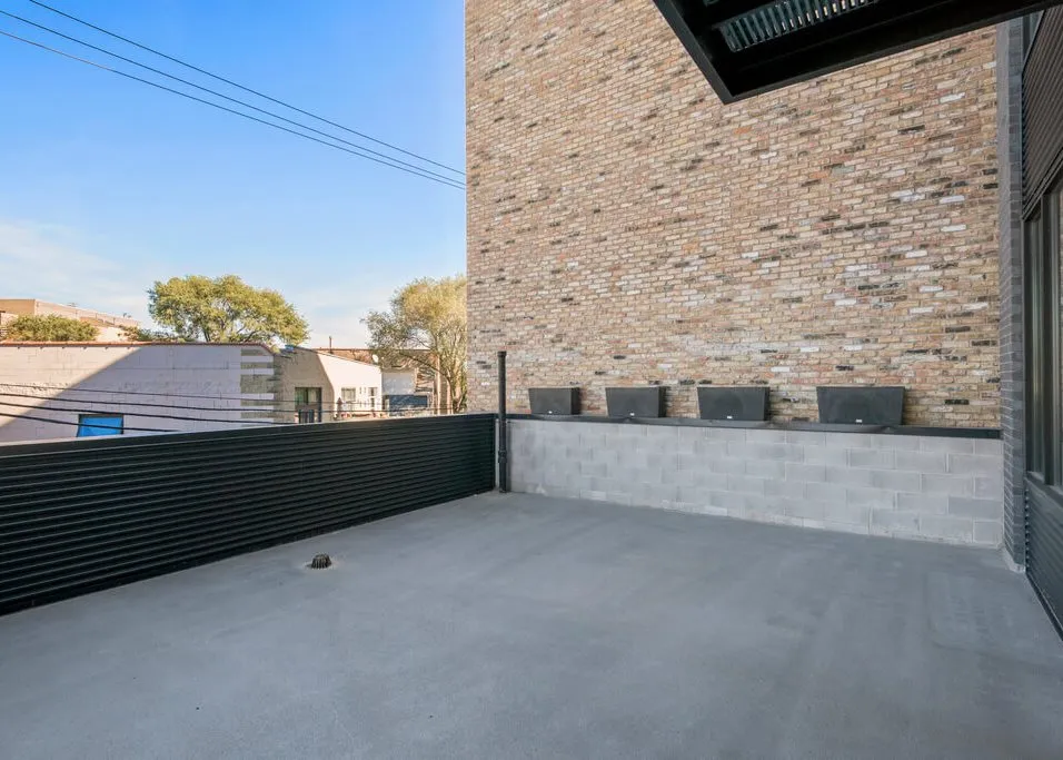 living room in the model apartment at 1647 North Milwaukee Apartments
