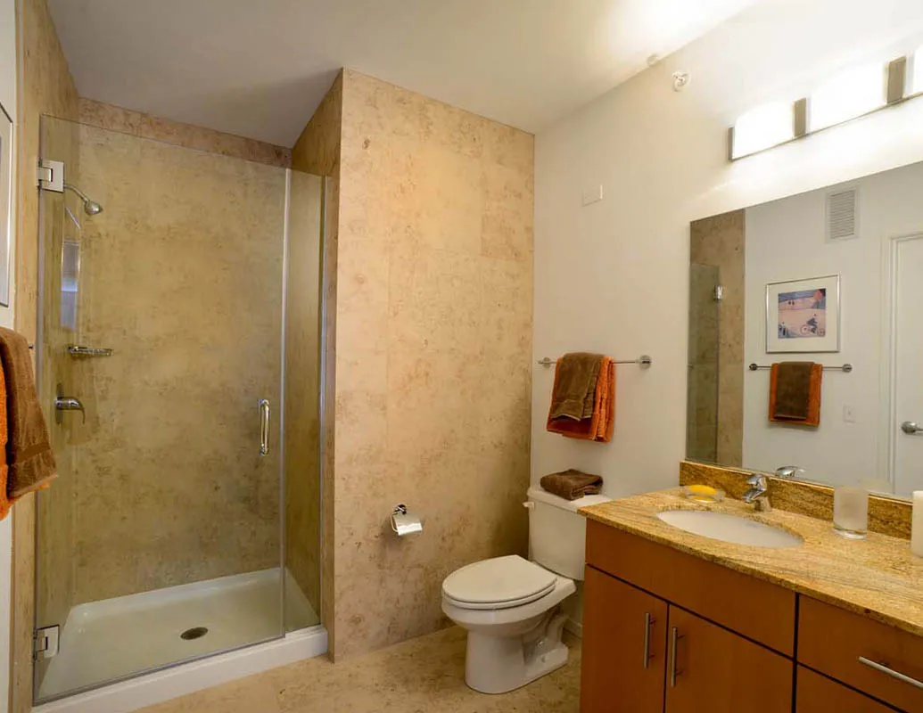 living room with wood floors and downtown view at Aston Chicago Apartments