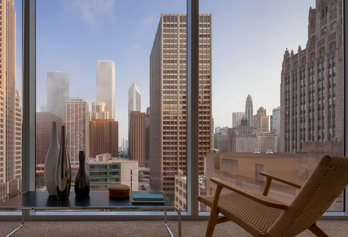 living room with wood floors and downtown view at Aston Chicago Apartments
