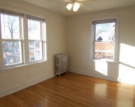 brick facade and courtyard of 4801-4809 North Fairfield Apartments