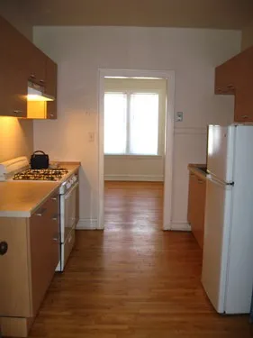 model kitchen with wood floors at 822-836 South Austin Apartments