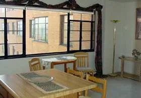 exterior view of trees and the two towers of 5630 North Sheridan Apartments