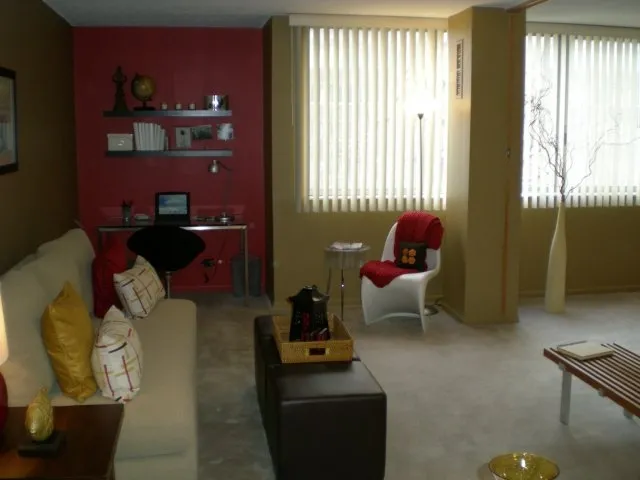 model bedroom with green wall at SCIO at the Medical District Apartments