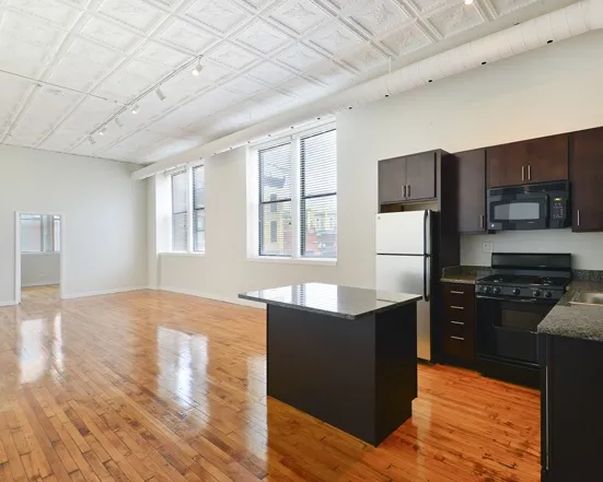 kitchen and living area at 1471 North Milwaukee Apartments in Wicker Park