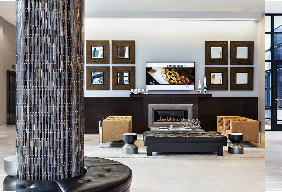 kitchen with view of living room at The Madison at Racine Apartments