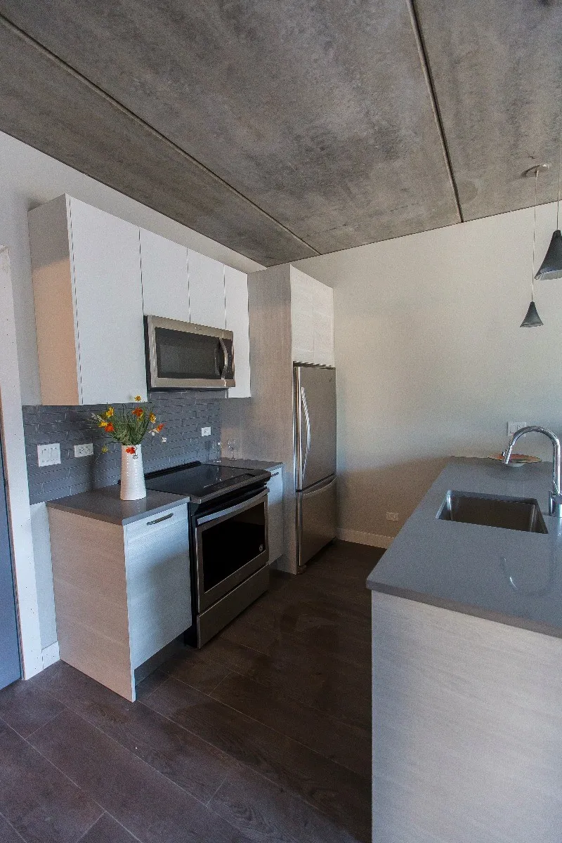 furnished luxury kitchen and living room at The Westerner Apartments