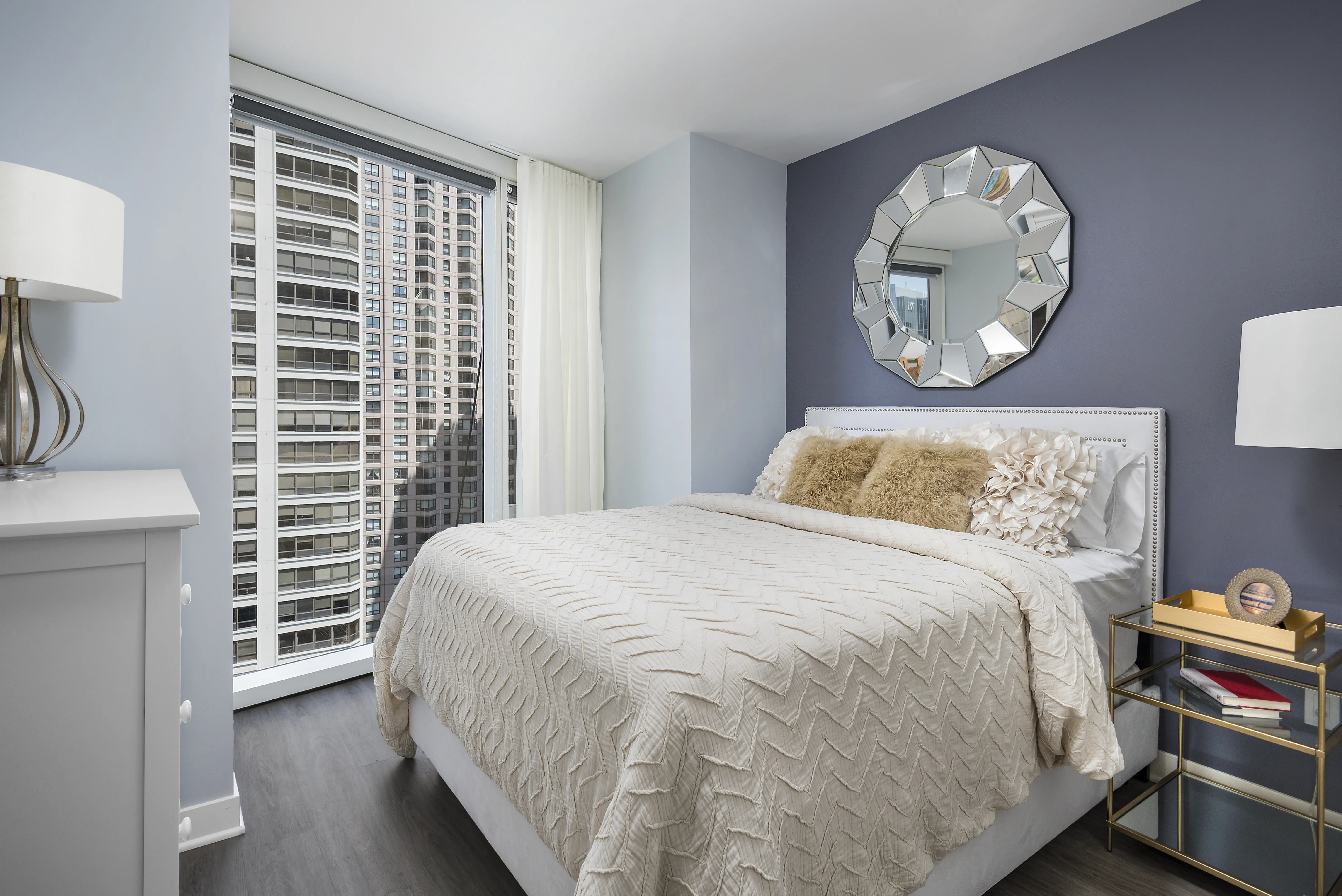 living room with brown couch at Moment Apartments in Streeterville Chicago