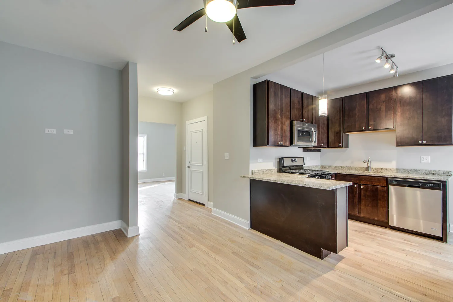 model living room and litchen at 836 East 53rd Apartments