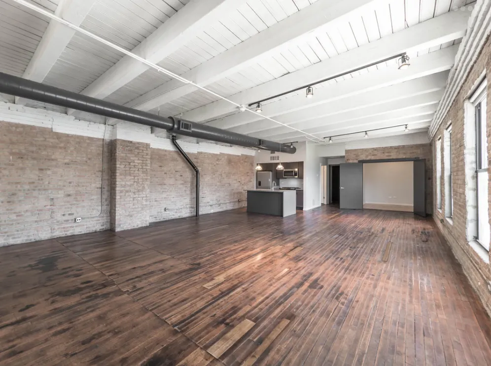 model kitchen with timber ceiling and brick wall- 1012 West Randolph Lofts