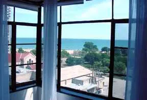 exterior view of trees and the two towers of 5630 North Sheridan Apartments
