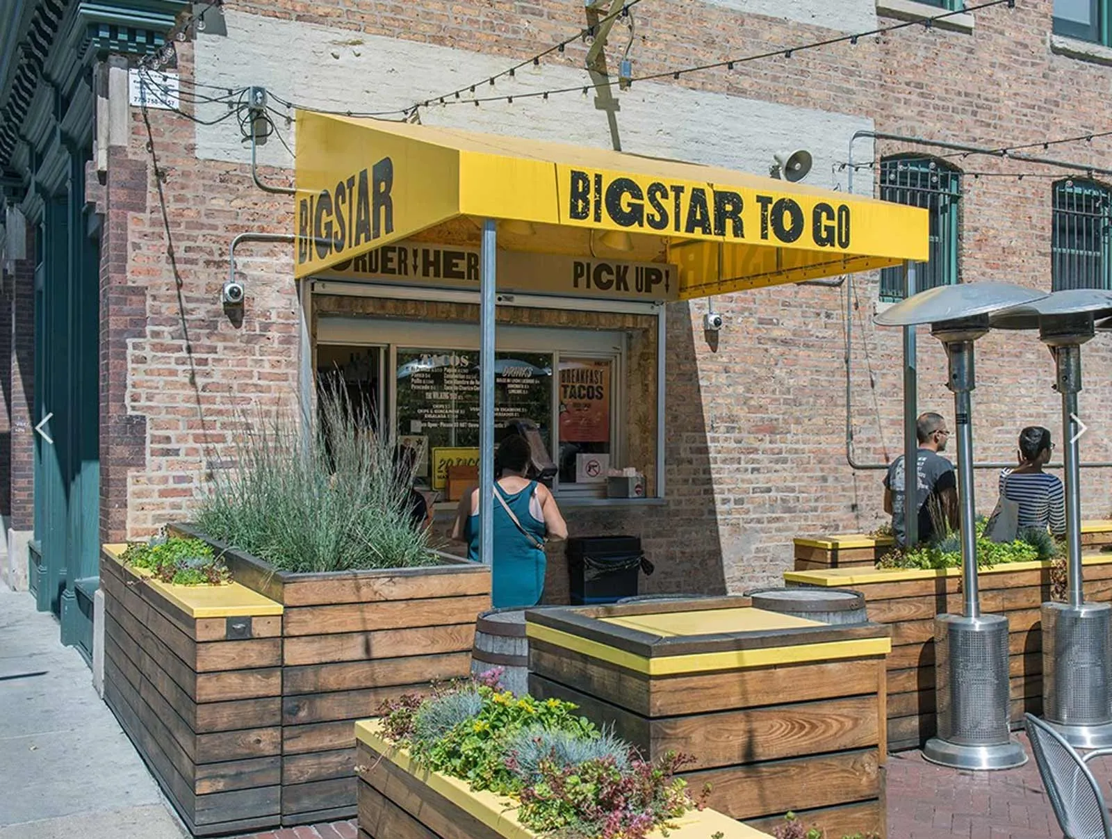 giant loft living room with wood floors at 1550 North Damen Lofts