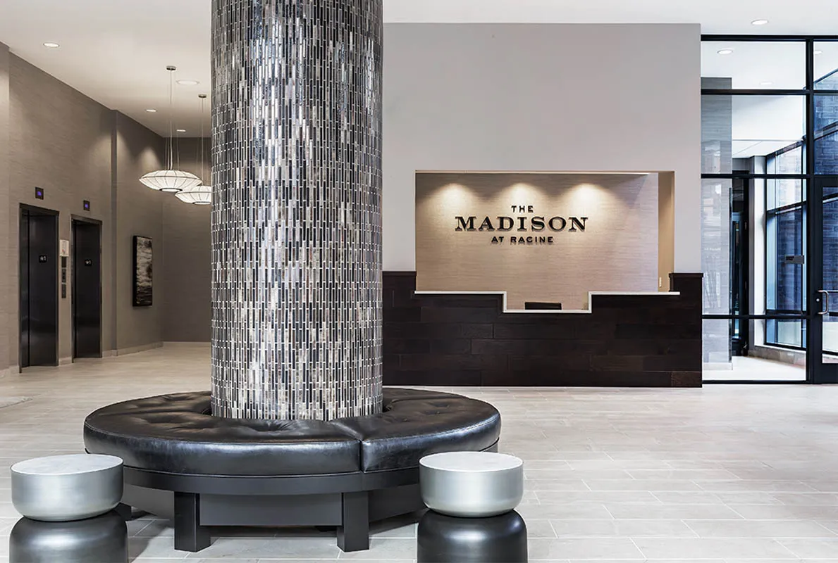 kitchen with view of living room at The Madison at Racine Apartments