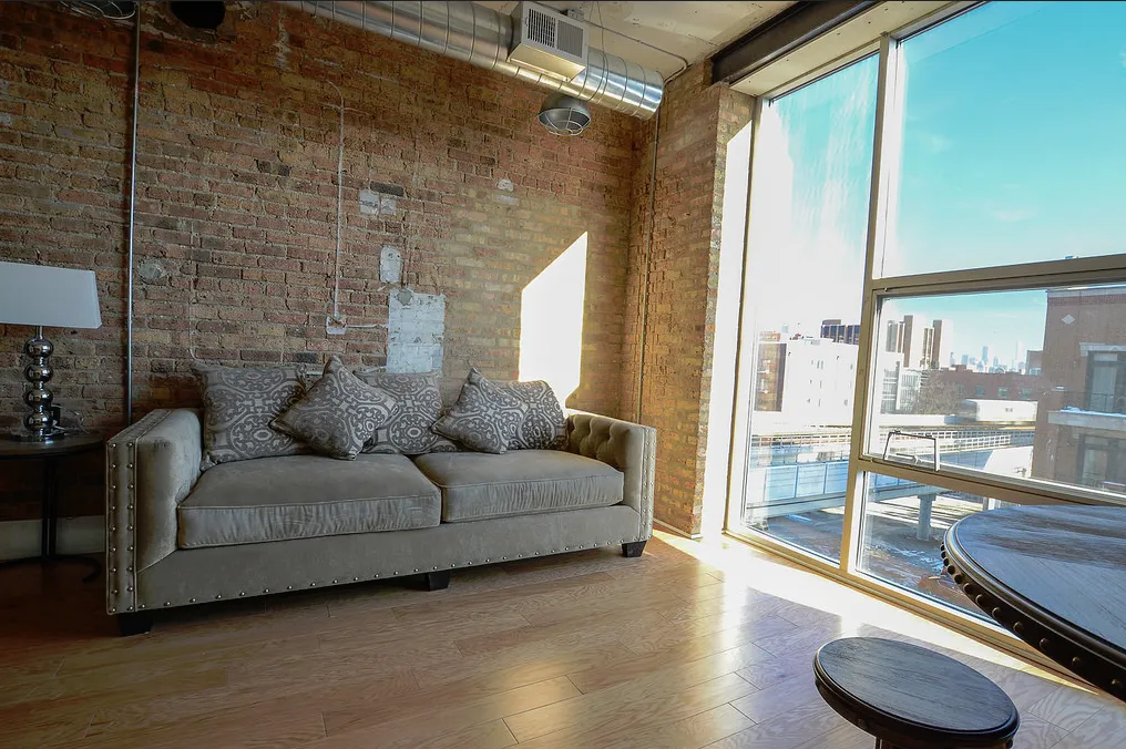 exposed brick in living room of 3141 North Sheffield Apartments in Lakeview