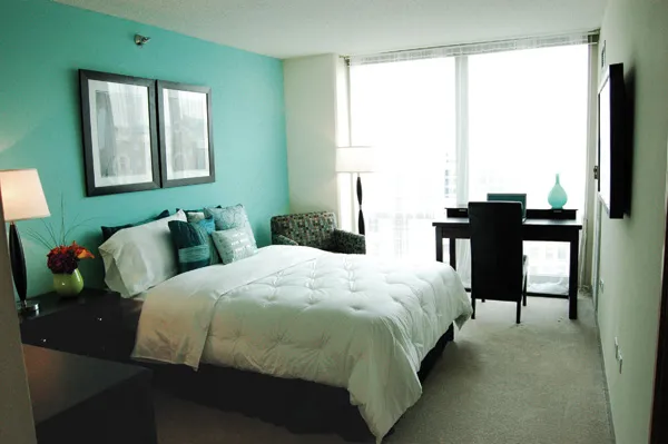 flowers surround the entrance of The Park Evanston Apartments in Evanston