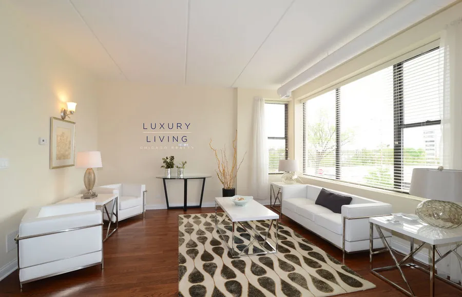 kitchen and island with wood floors at Riverview Terrace Apartments