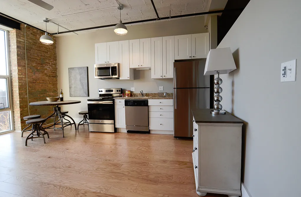 exposed brick in living room of 3141 North Sheffield Apartments in Lakeview