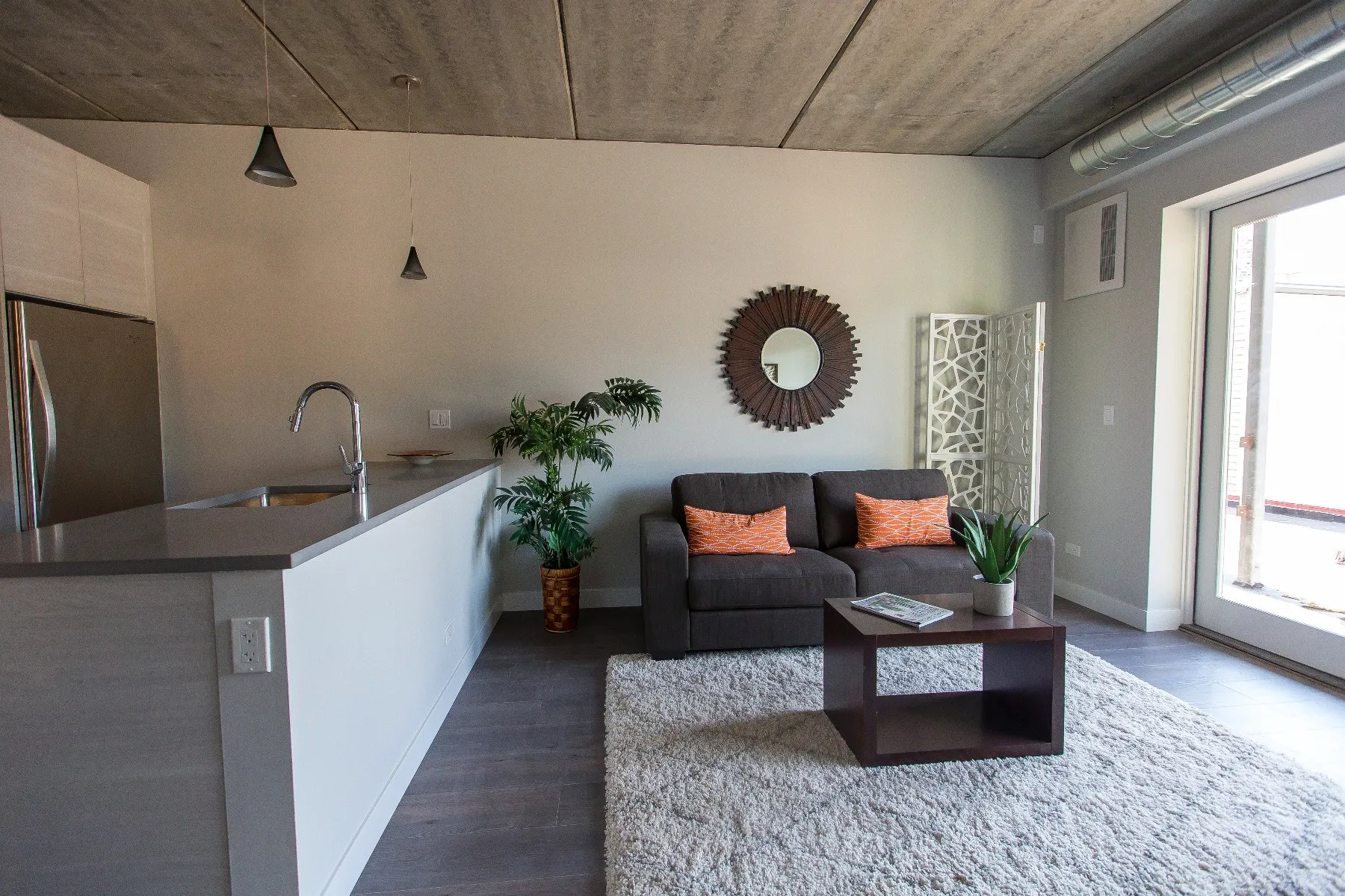 furnished luxury kitchen and living room at The Westerner Apartments