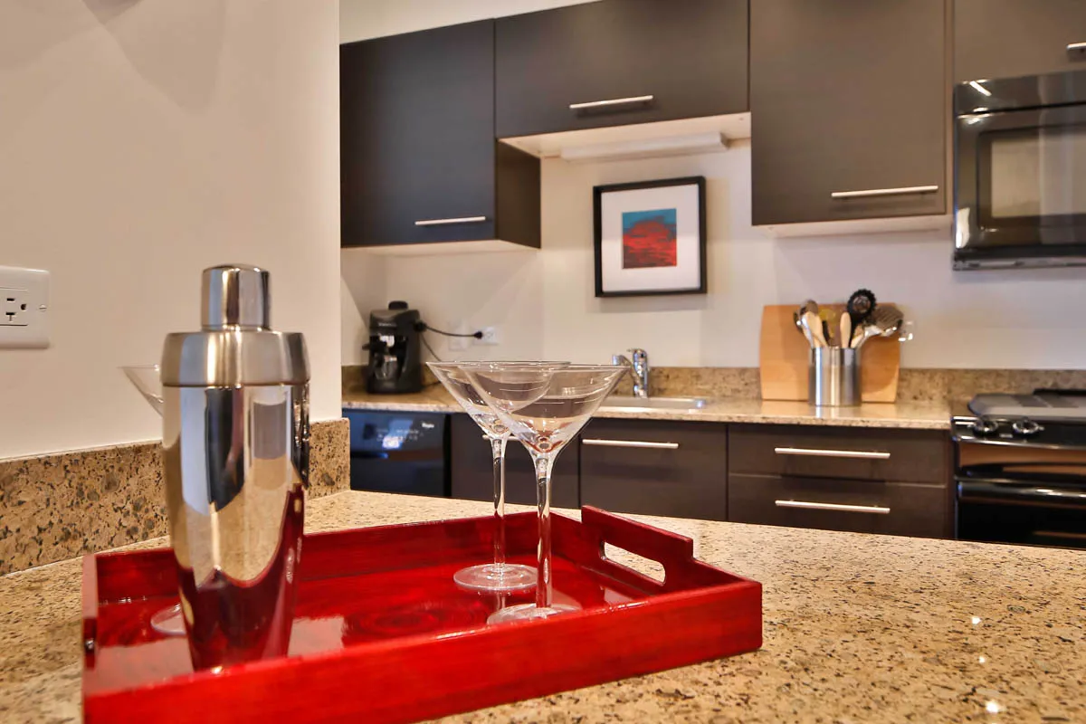 furnished living room with glass window at SoNo East Apartments