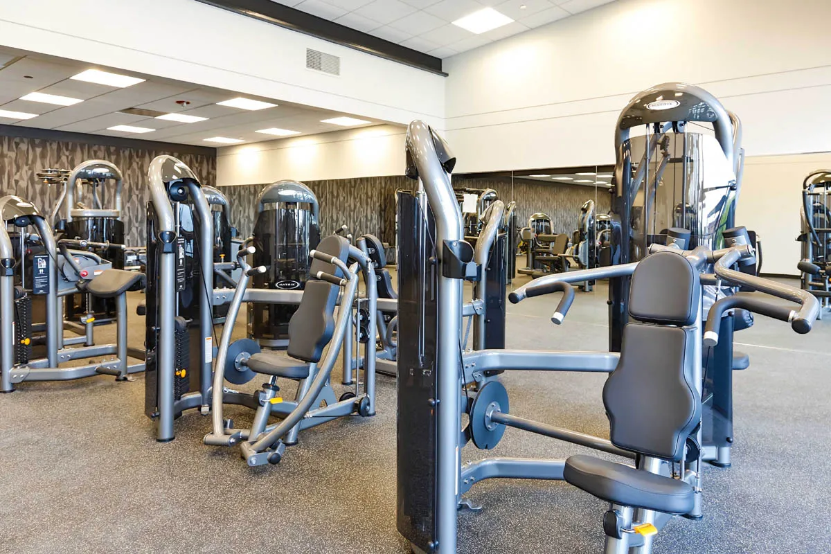 furnished living room with glass window at SoNo East Apartments