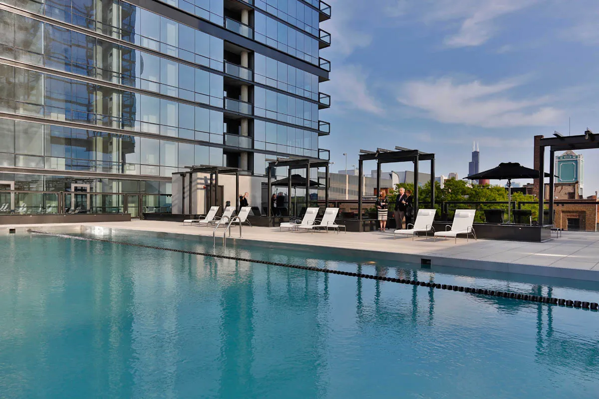 furnished living room with glass window at SoNo East Apartments