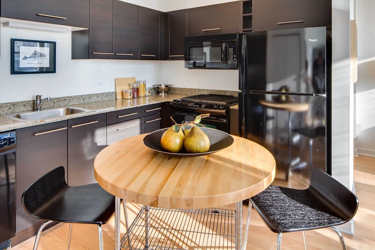 furnished living room with glass window at SoNo East Apartments