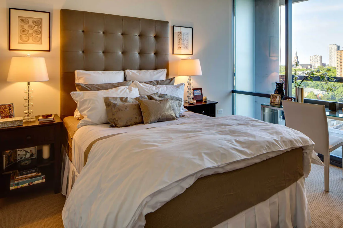 furnished living room with glass window at SoNo East Apartments