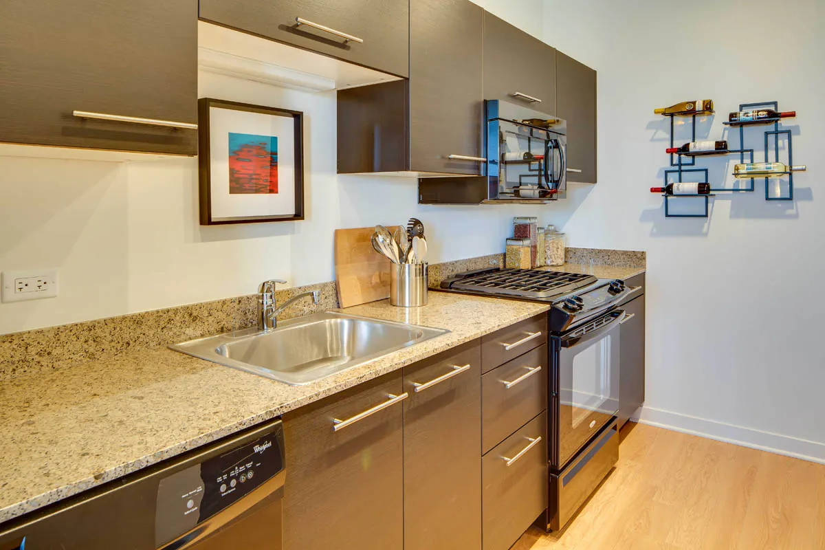 furnished living room with glass window at SoNo East Apartments
