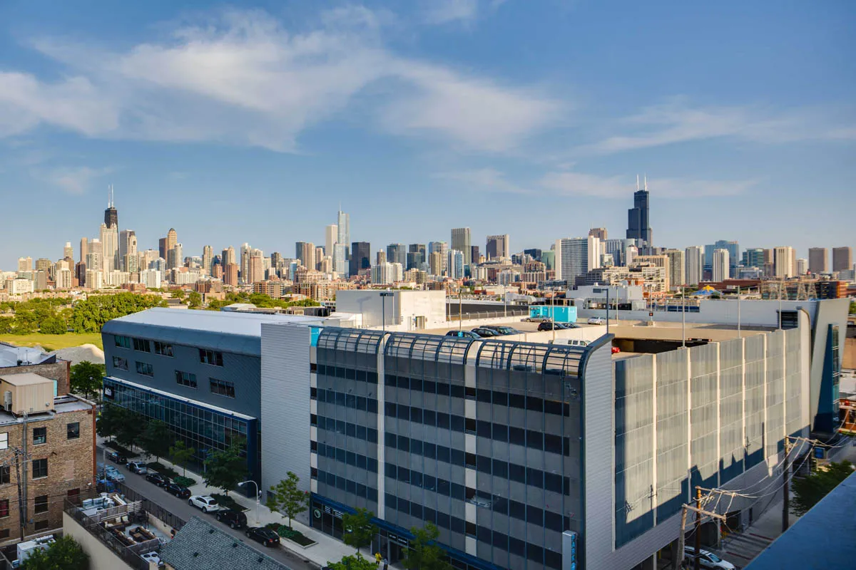 furnished living room with glass window at SoNo East Apartments