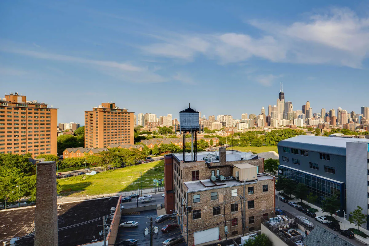 furnished living room with glass window at SoNo East Apartments