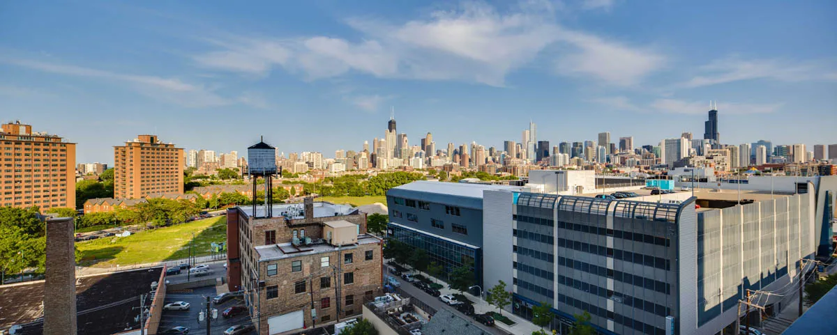furnished living room with glass window at SoNo East Apartments