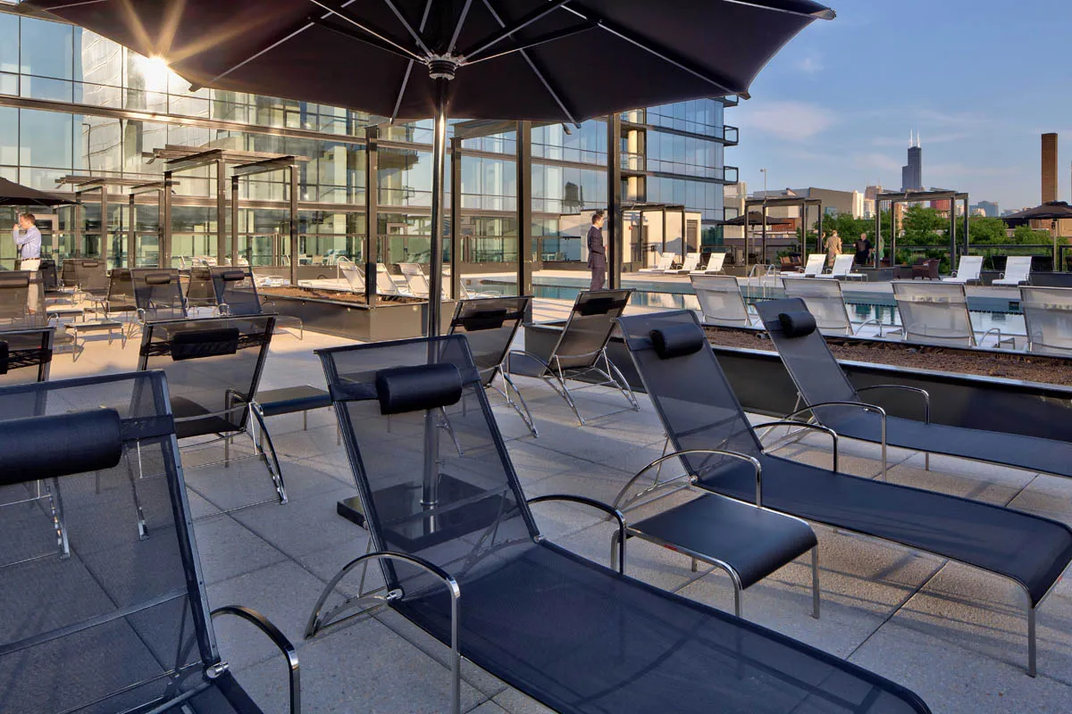 furnished living room with glass window at SoNo East Apartments