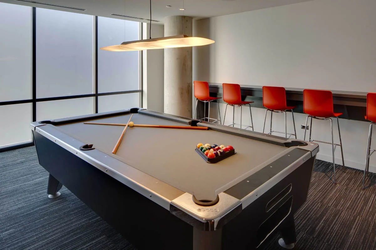 furnished living room with glass window at SoNo East Apartments