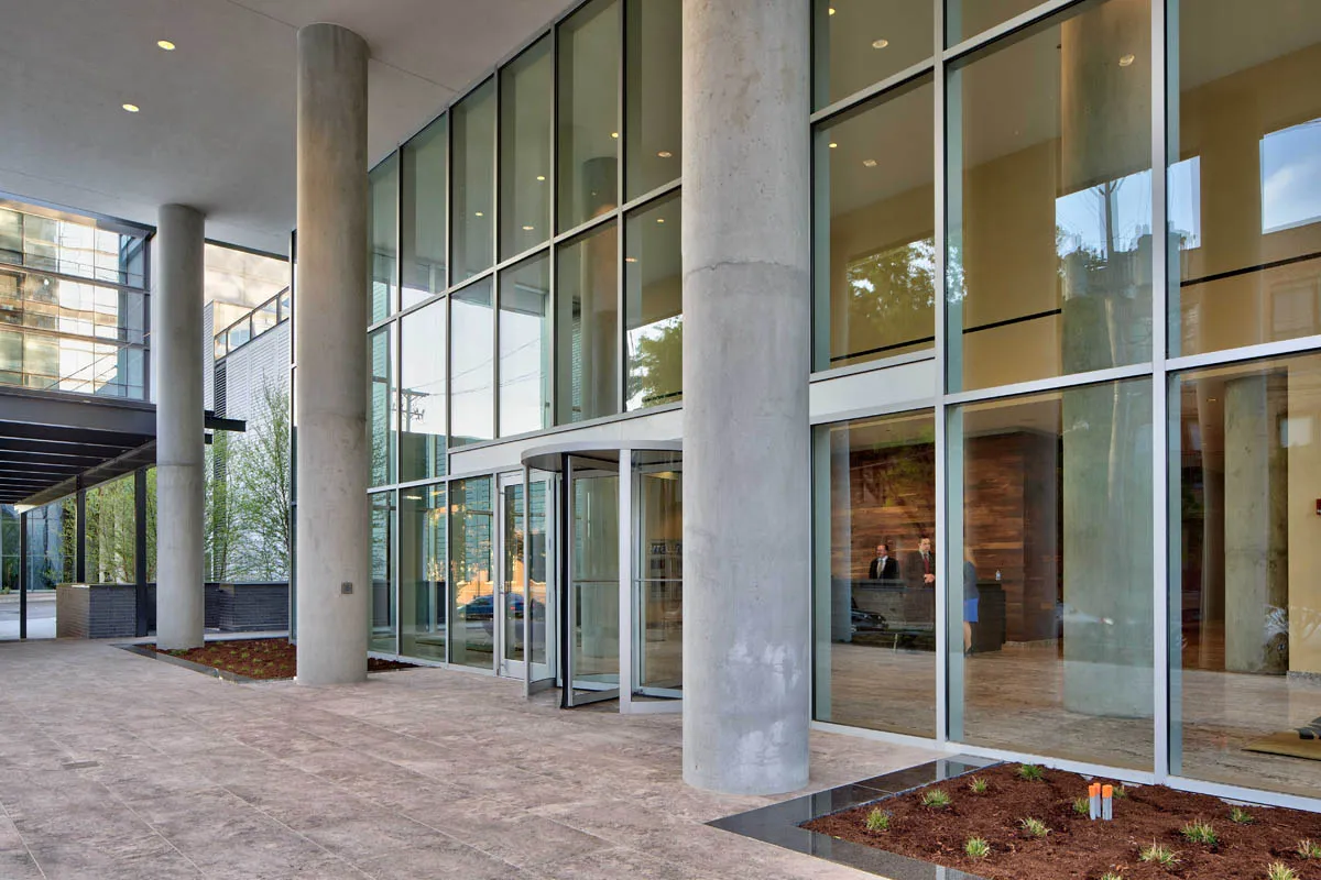 furnished living room with glass window at SoNo East Apartments