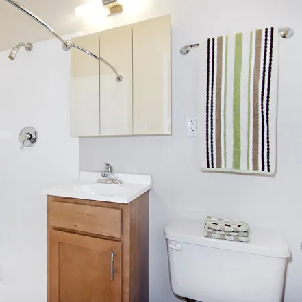 corner view of Reside 2525 Apartments with Starbucks on 1st floor